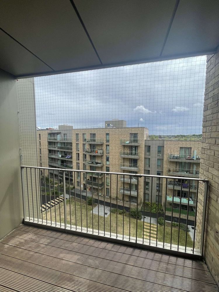 Netted balcony looking across to a new block of flats