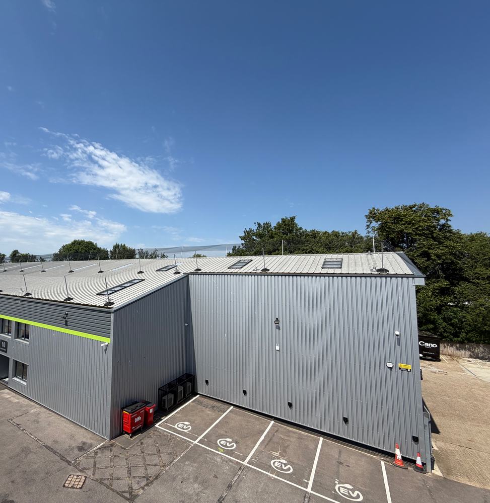 Commercial unit with bird netting across its roof